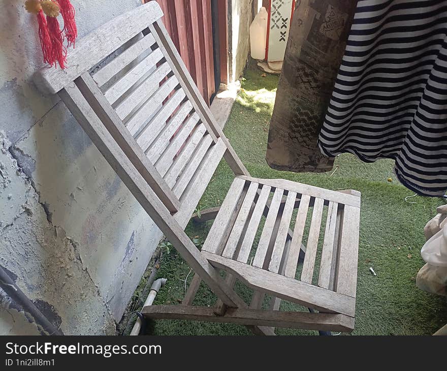 a folding chair made from used wood that has not been used for a long time