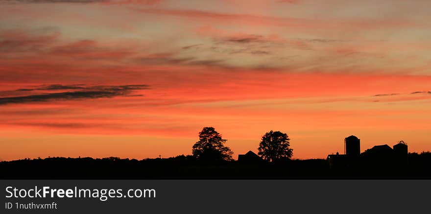 Farm Silhouette In The Evening Sunset.  Country Life Is Great.