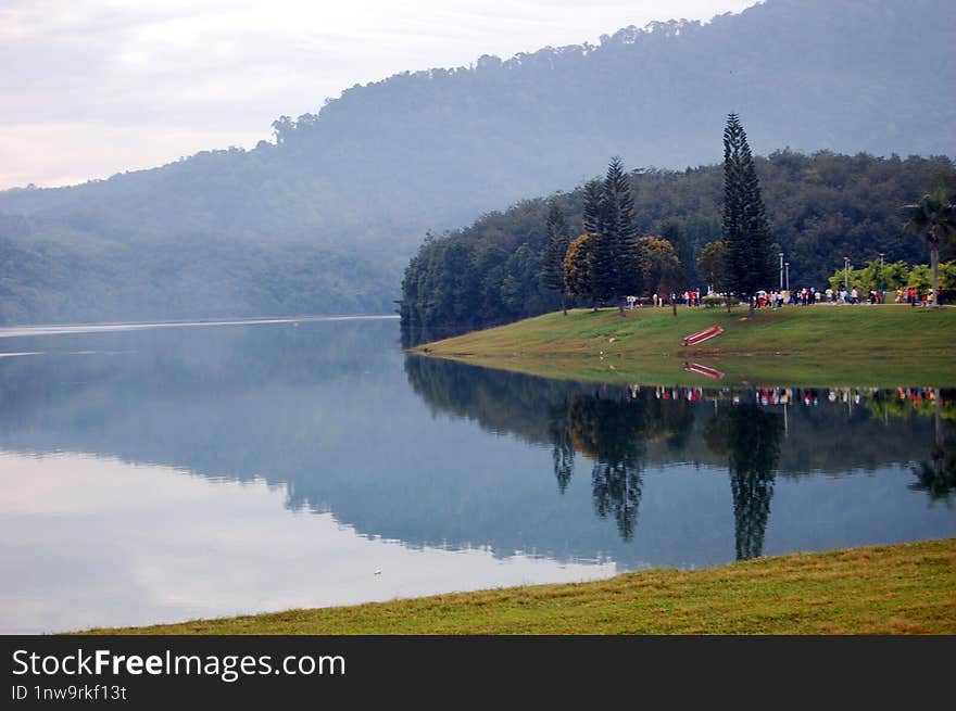 A Lot Of People Jogging Near The Mengkuang Dam