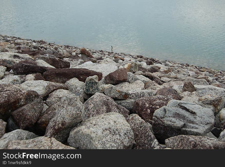 Several Rock Laid In A Dam