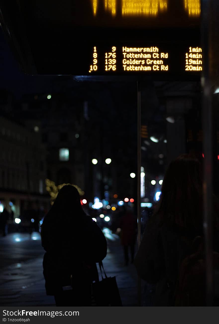 Waiting for the bus at night