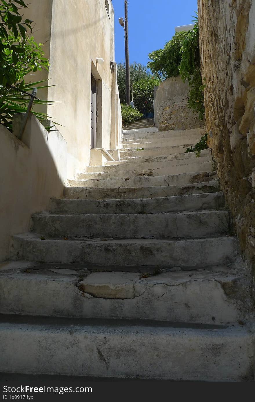 View of a narrow street in a village in Greece