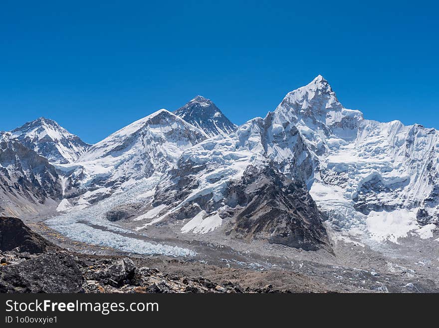 Mount Everest, standing at 8,848.86 meters, is the highest peak in the world, located in the Himalayas between Nepal and China.