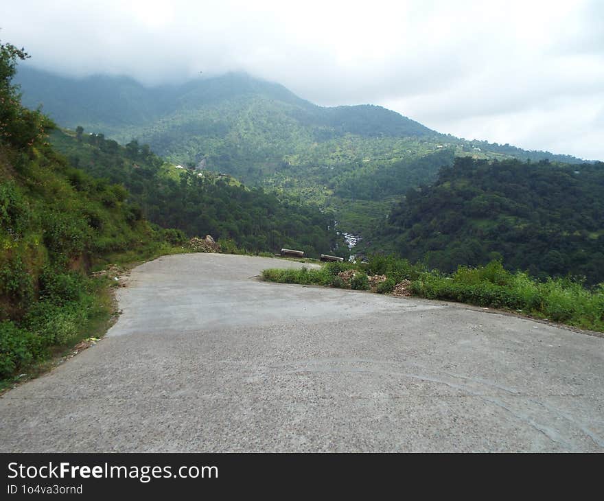 The Road Continues Its Lonely Journey, Evoking A Sense Of Mystery And Isolation.