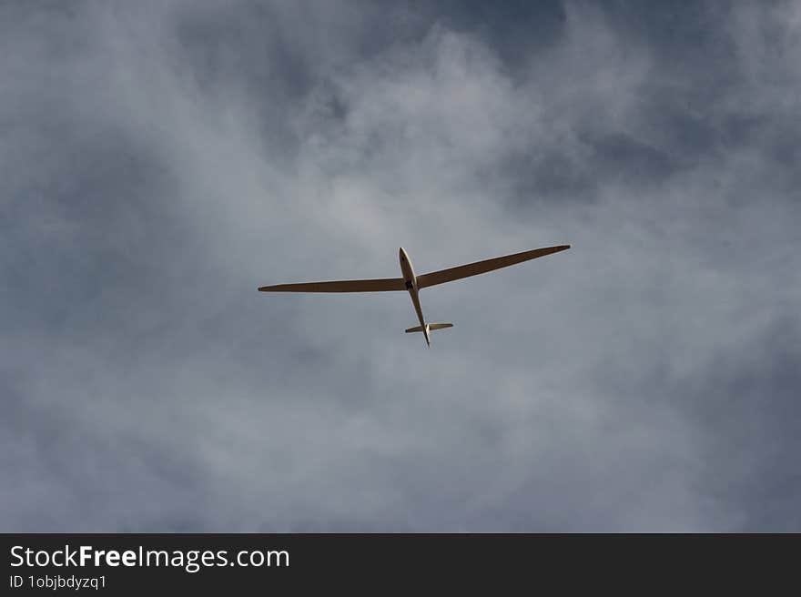 An Image Of A Delta Glider Flying In The Sky.