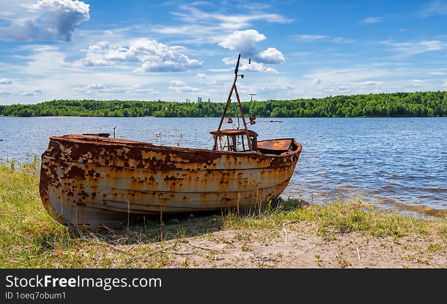 Old abandoned fishing boat on the shore. Old abandoned fishing boat on the shore.