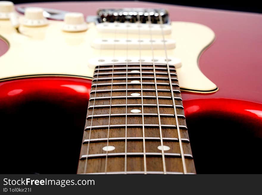 Electric guitar body isolated on black background. Entertainment and music concept.