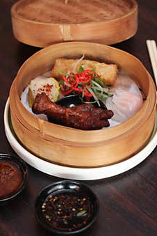 A Vibrant Plate Featuring A Selection Of Asian Dumplings And Steamed White Rice, Complemented By A Serving Of Red Char Siu Pork, G Royalty Free Stock Photography