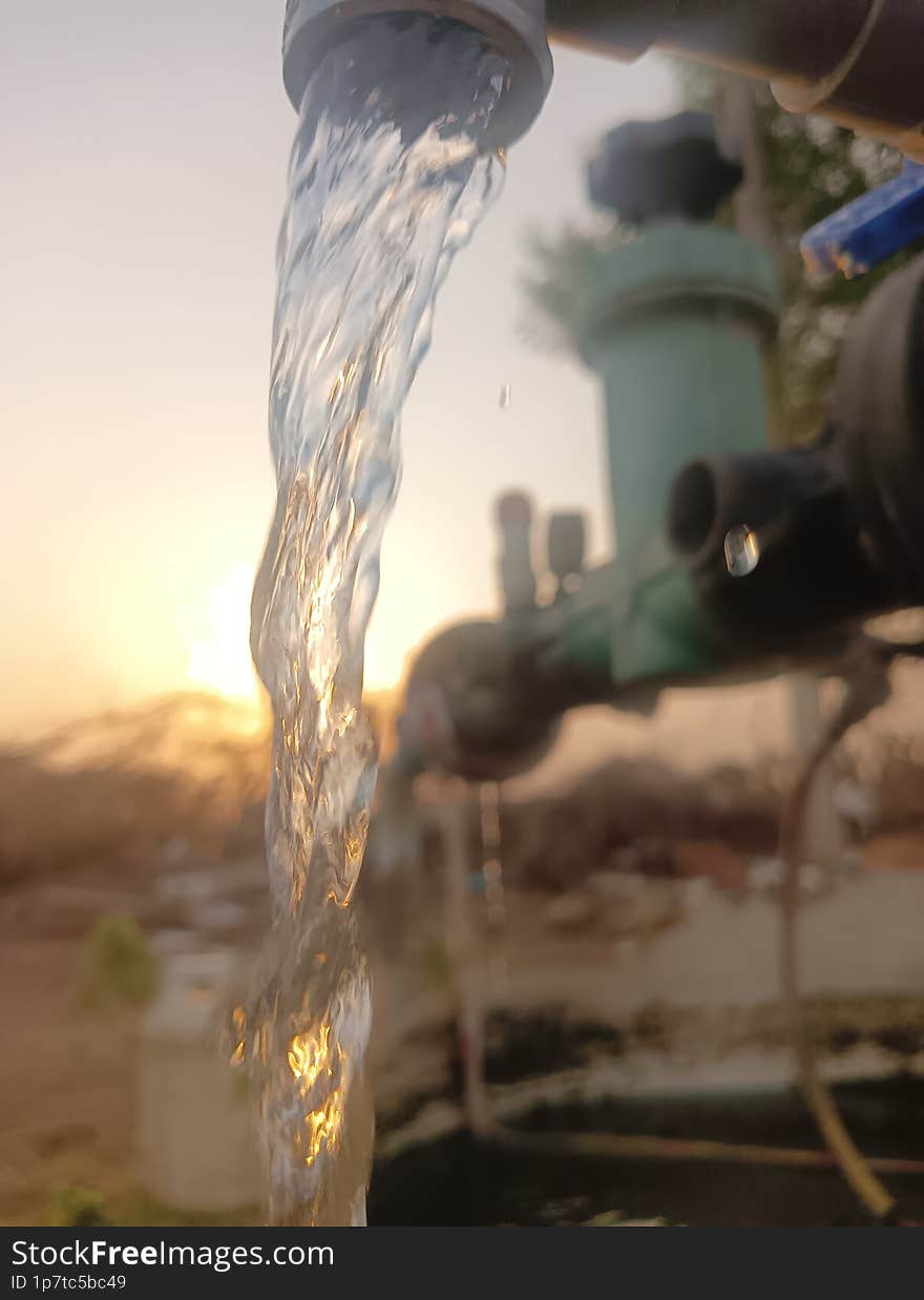 Water falling  infront of sunset