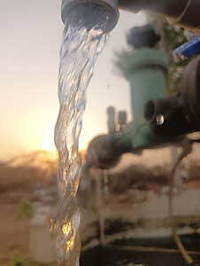 Water Falling  Infront Of Sunset Stock Photography