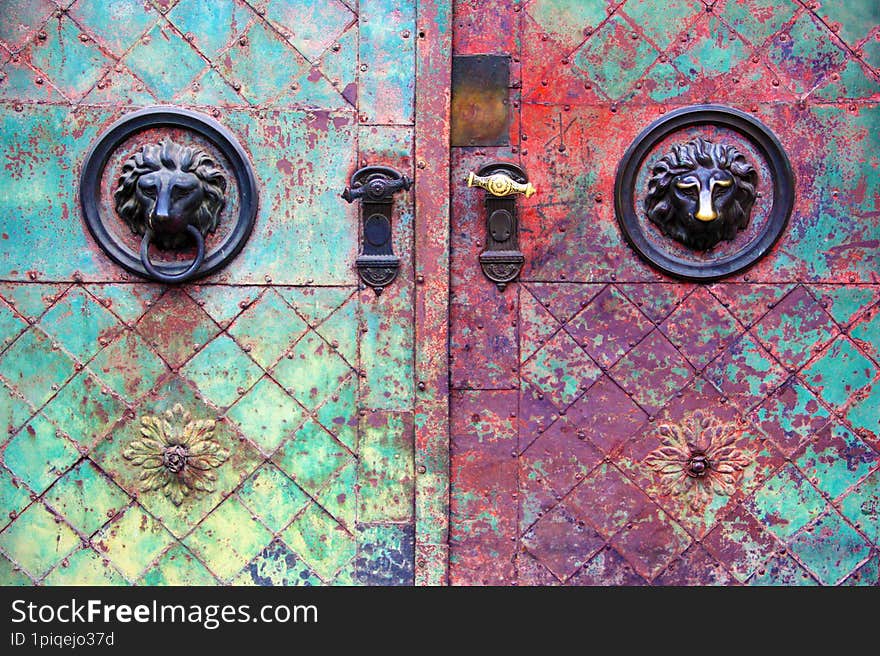 Old doors with a rusty hooks