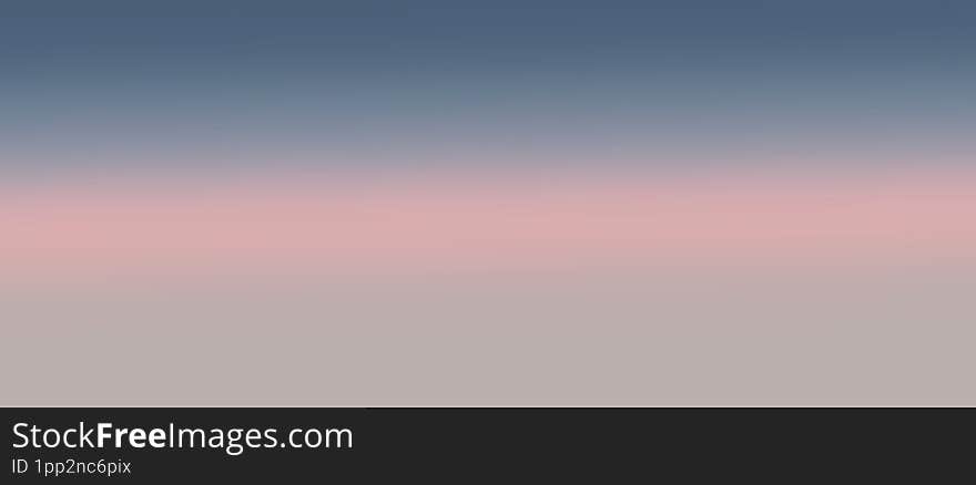 Dusk sky showcases a captivating gradient from soft pink to deep blue hues