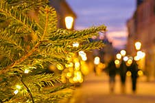 Intentional Blur Tourist Pedestrians Walk In Europe Street On Xmas Surrounded By Traditional Architecture. Family Christmas Holida Royalty Free Stock Images