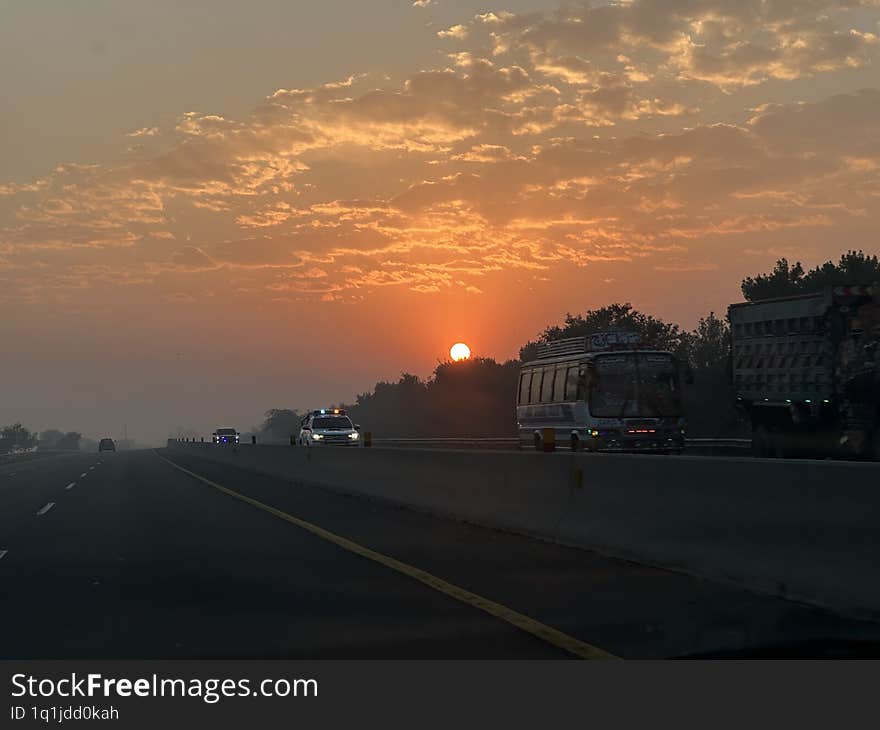 A Perfect Highway Sunrise with Clouds