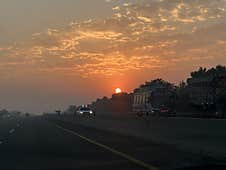 A Perfect Highway Sunrise With Clouds Stock Photos