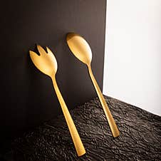 Elegant Golden Spoon And Fork On A Minimalist Black Background Royalty Free Stock Images