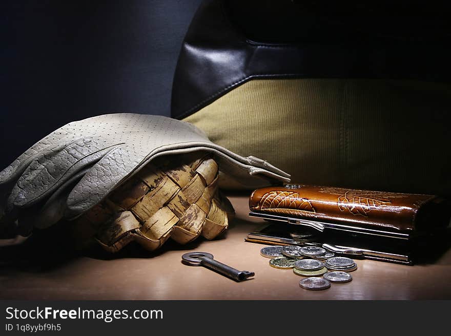 Still life with women's accessories: purse, gloves and bag