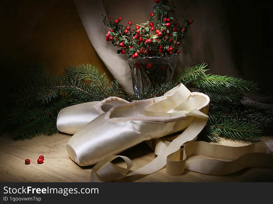 Still life with ballet shoes and festive attributes of Christmas