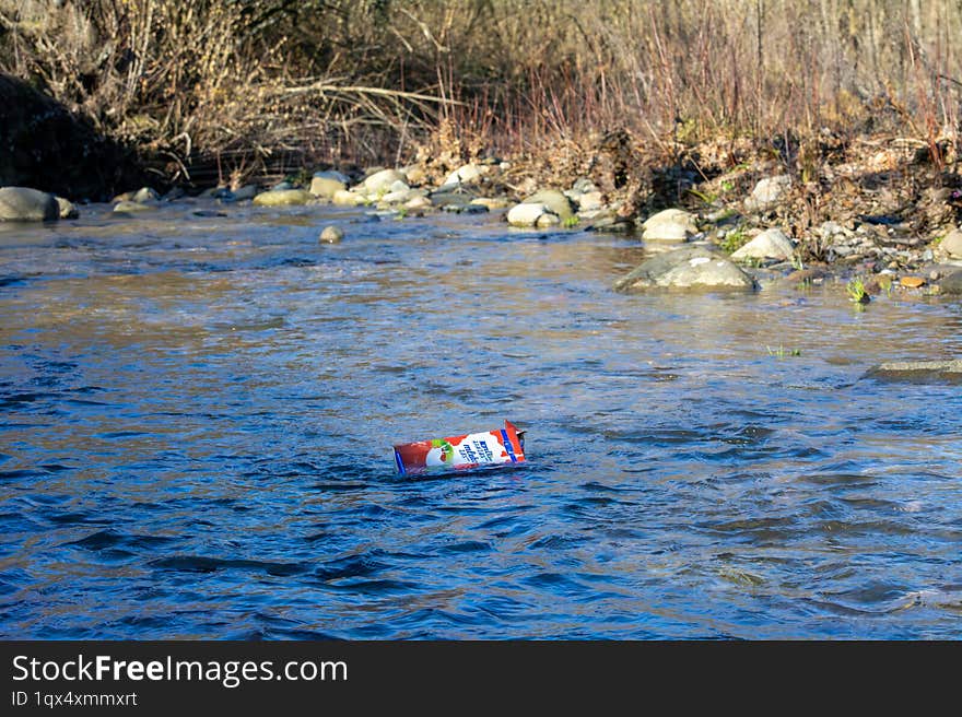 Milk carton thrown into river