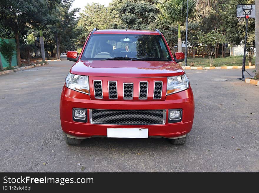 Mahindra TUV 300 Lava Red automatic SUV on the road. Mahindra TUV 300 Lava Red automatic SUV on the road.