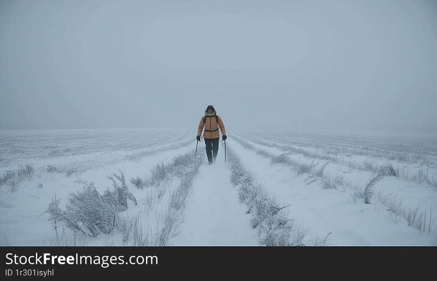 a snowy field on a foggy day  concept adventure, expedition, traveling, vacations and recreation outdoors winter landscape