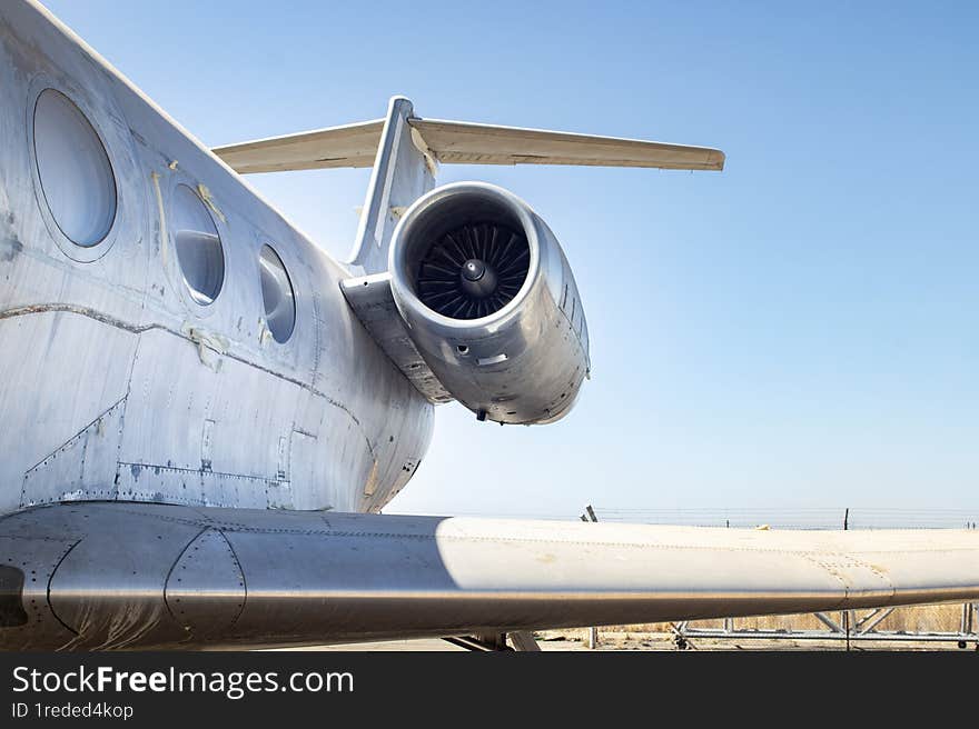 Abandoned aircraft showing engine at graveyard