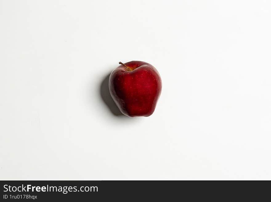 a fresh red apple on a white background