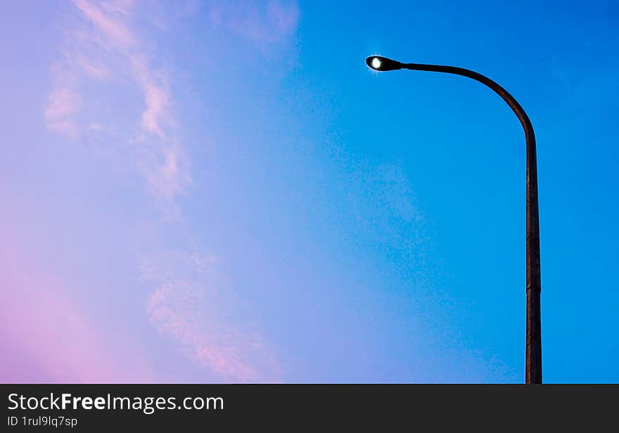 Street lighting in the morning with sky gradations from orange to blue