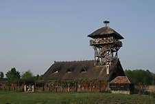 An Old Barn In A Field With A Watchtower. Royalty Free Stock Image