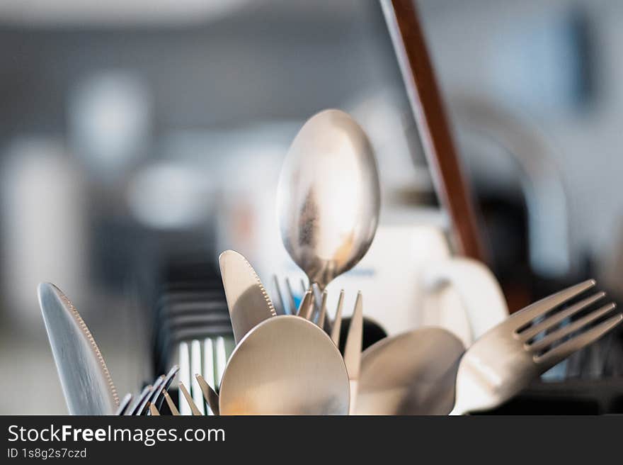 Metal spoon, forks and knives drying