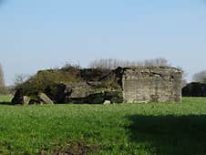 Partially Collapsed Bunker In Flemish Meadow Royalty Free Stock Photo