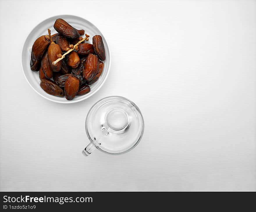 dried dates and a glass of water