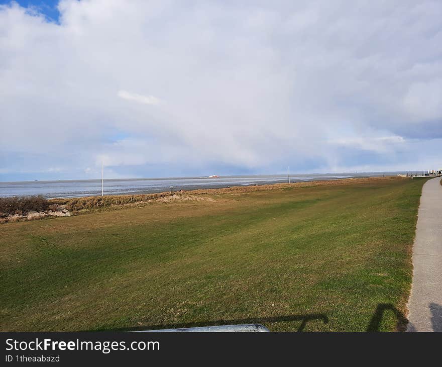 path on the dike in cuxhaven duhnen north sea germany wadden sea