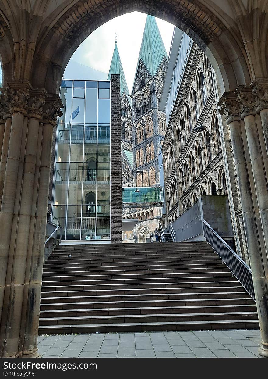 the biuld shows an archway with a view of the cathedral in bremen. the biuld shows an archway with a view of the cathedral in bremen