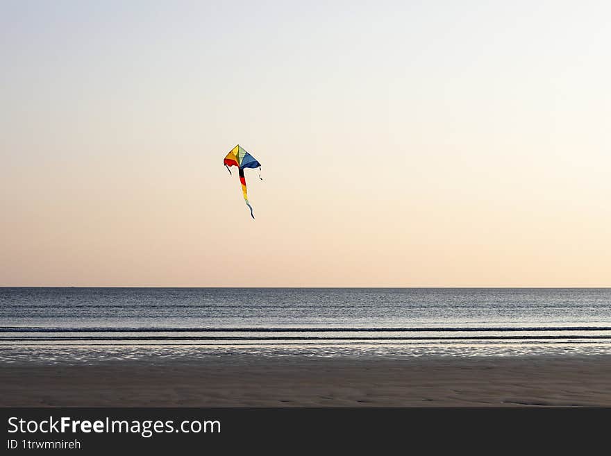 Camaret-sur-Mer, Brittany, France, coastal landscapes, Finistère.Colorful kite flying by the sea during a golden sunset � a joyful moment by the coast full of light and freedom.