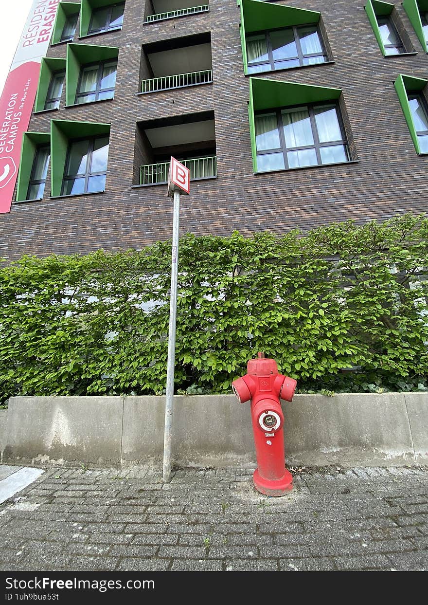 Brussels, Belgium 04-15-2025. Student campuses. Fire hose. In the background, student housing belonging to the erasme university hospital