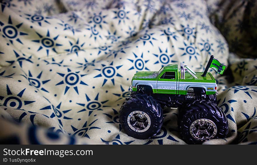 South Minahasa, Indonesia - January 29, 2023: toy monster car on blanket