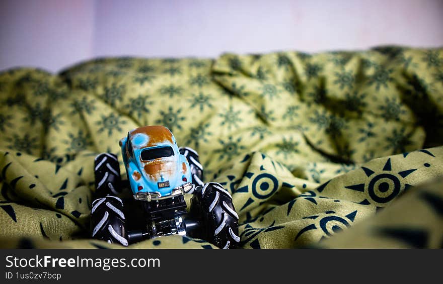 South Minahasa, Indonesia - January 29, 2023: toy monster car on blanket