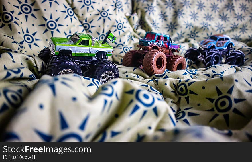South Minahasa, Indonesia - January 29, 2023: toy monster car on blanket