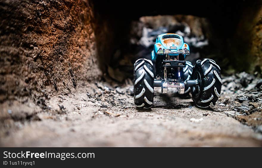 South Minahasa, Indonesia - January 29, 2023: a toy monster car on a traditional stove