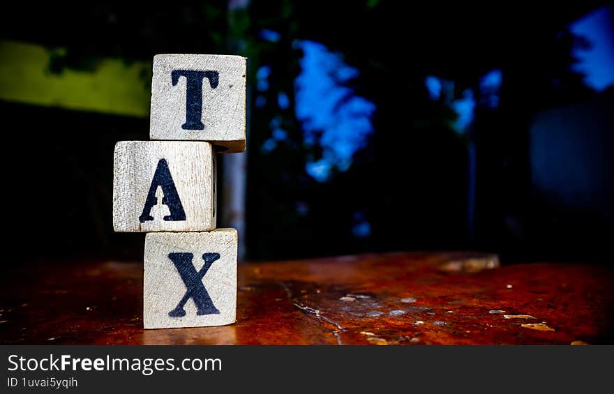 blocks with tax inscription as background