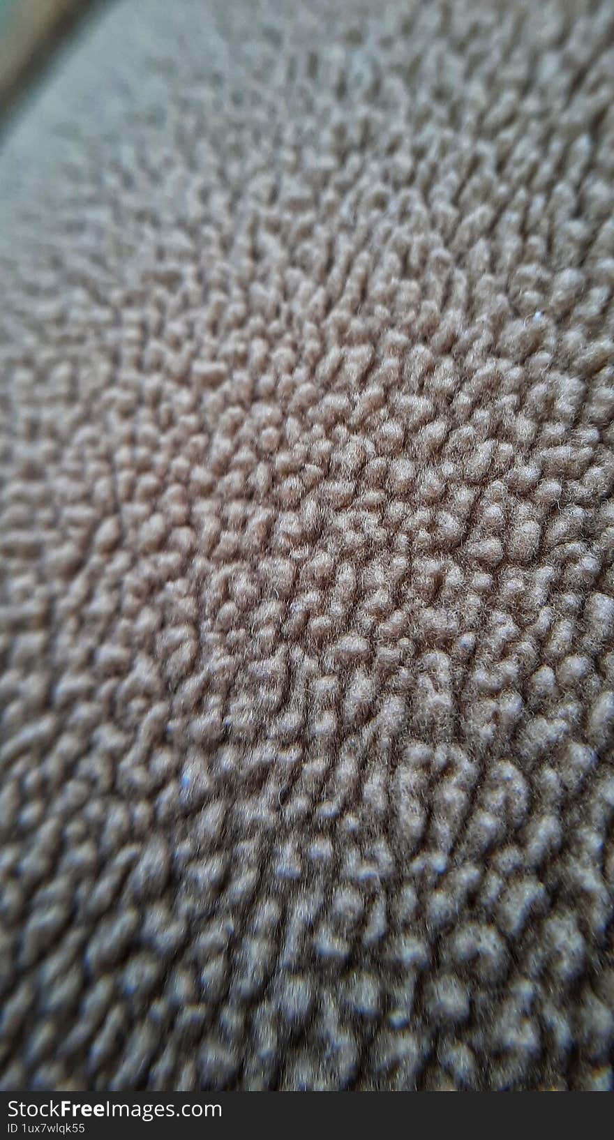 brownrown pile sheep background. texture brown pile.  brown fabric macro