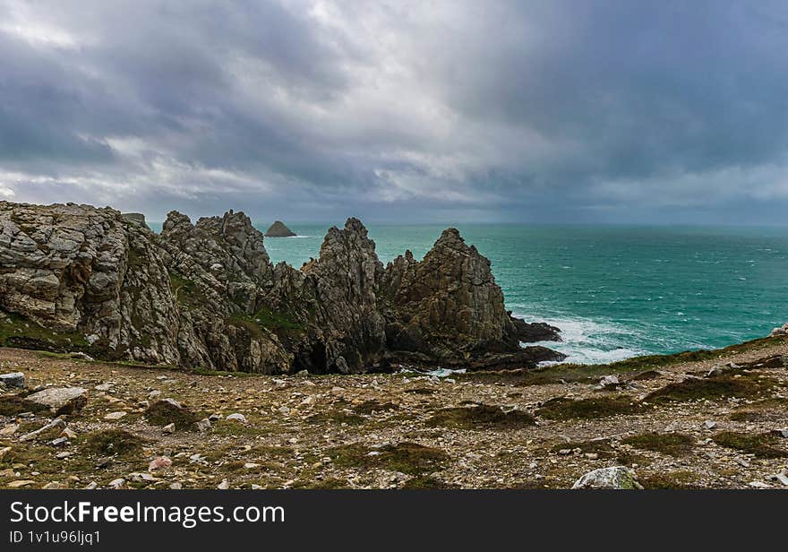 Dark cliffs and emerald ocean of Crozon