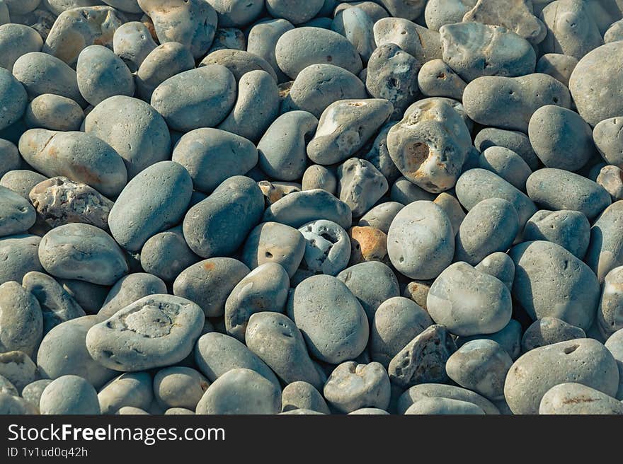 textured grey pebbles on the beach
