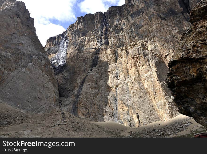A waterfall flowing through a narrow crevice between rocks in Shahdag in the Caucasus Mountains