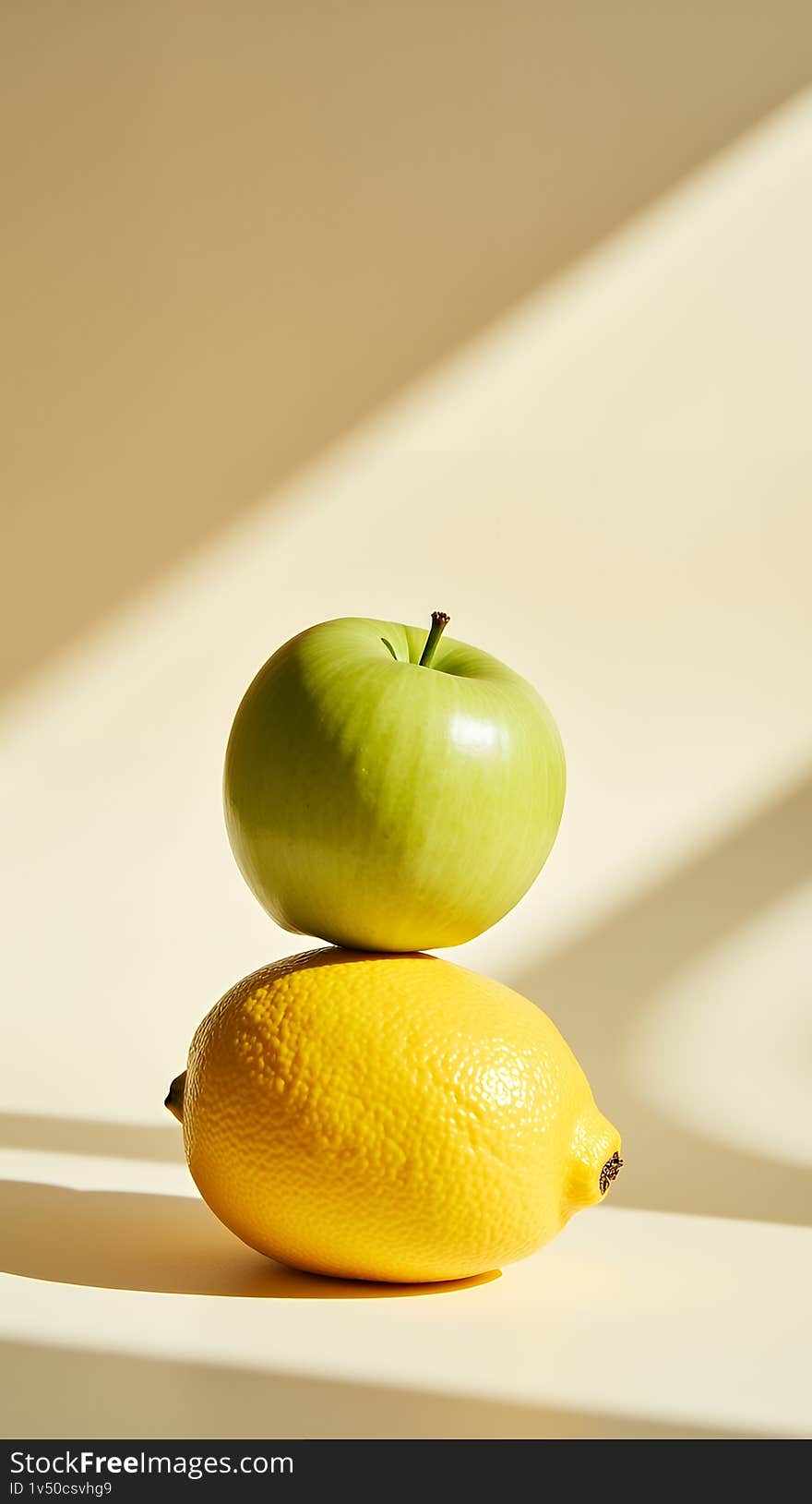 A vibrant still life featuring a green apple delicately balanced on top of a bright yellow lemon. The image is set against a soft, beige background with dramatic sunlight casting shadows. Perfect for concepts related to health, freshness, minimalism, and food photography. Ideal for blogs, websites, or marketing materials. A vibrant still life featuring a green apple delicately balanced on top of a bright yellow lemon. The image is set against a soft, beige background with dramatic sunlight casting shadows. Perfect for concepts related to health, freshness, minimalism, and food photography. Ideal for blogs, websites, or marketing materials.