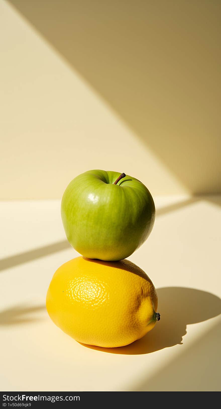 A vibrant still life featuring a green apple delicately balanced atop a ripe yellow lemon. The composition is enhanced by dramatic sunlight casting shadows on a light beige background. This image is perfect for concepts related to health, freshness, food, and minimalist aesthetics. Ideal for blogs, websites, or marketing materials. A vibrant still life featuring a green apple delicately balanced atop a ripe yellow lemon. The composition is enhanced by dramatic sunlight casting shadows on a light beige background. This image is perfect for concepts related to health, freshness, food, and minimalist aesthetics. Ideal for blogs, websites, or marketing materials.