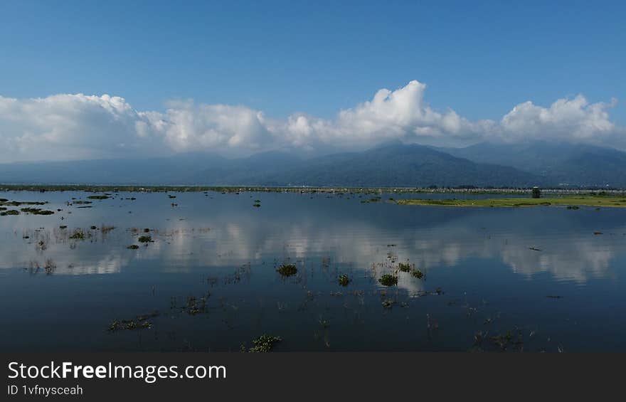 lake with mountain and blue sky background
