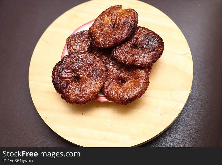 With rice flour dough  mixed with jagger powder