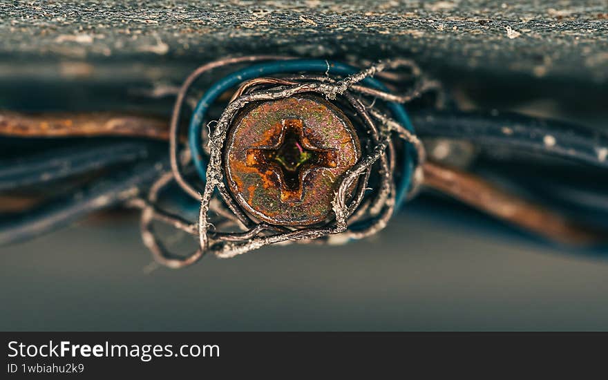 Close up of screw with wires electrical connection repair and install